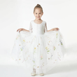 young girl modelling a white dress from uk flower girl boutique