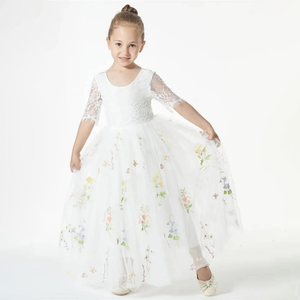 young girl modelling a white dress from uk flower girl boutique