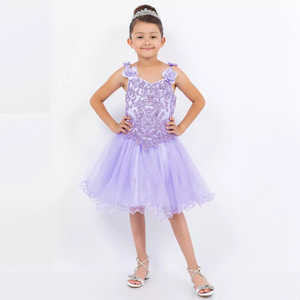 girl wearing a lilac sequin, lace and soft tulle party dress