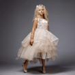 Model wearing a blush coloured Princess Evangeline party dress