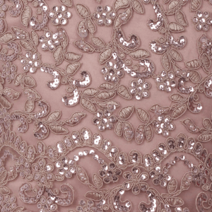 beaded detail on a mauve coloured dress