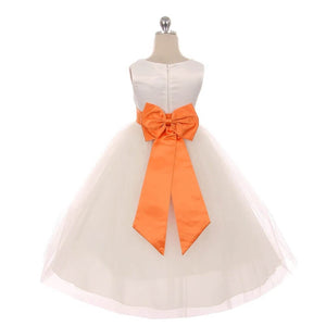 White dress with orange bow on the back 
