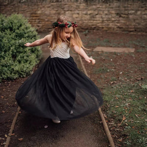 young girl swirling in flower girl dress