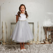 Girl in a Silver party dress from UK Flower Girl Boutique