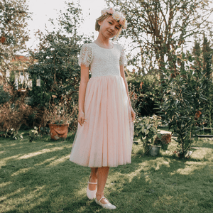 girl wearing bohemian flutter tea dress for uk flower girl boutique