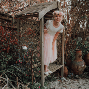 girl wearing bohemian flutter tea dress for uk flower girl boutique