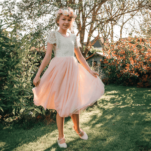 girl wearing bohemian flutter tea dress for uk flower girl boutique