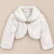 A white faux fur cropped jacket with a wide collar and a decorative rhinestone-embellished button closure, displayed flat against a solid beige background.