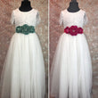 Green and red floral sashes on white dresses