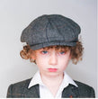 Boy wearing baker boy cap