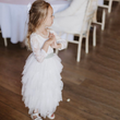 Young girl at a wedding  in UK Flower Girl Boutique dress
