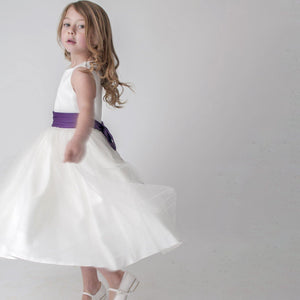 Girl twirling in party dress