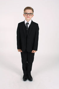 Young boy wearing a black occasion suit