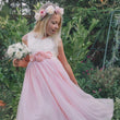 girl in pink party dress with bouquet