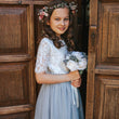 young girl in church doorway