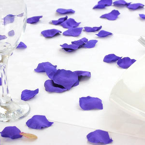 purple petals on a whit table cloth