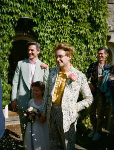 Two men getting married with flower girl 