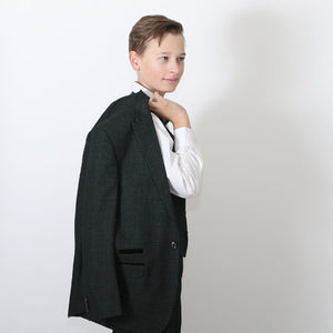 young boy holding jacket