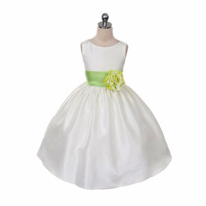 Morgan dress in white with green sash on mannequin