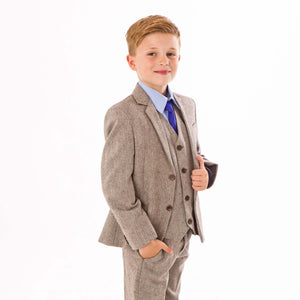 Boy wearing brown herringbone suit for UK Flower Girl Boutique