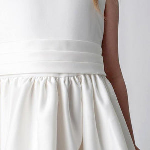 White sash on girls dress