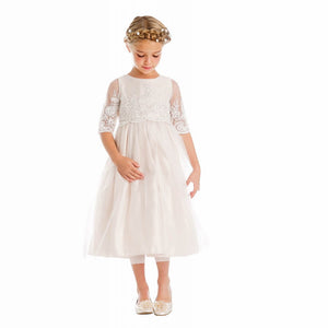 Young girl wearing Harlow dress in Champagne colour