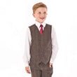 Boy wearing brown check waistcoat and trousers