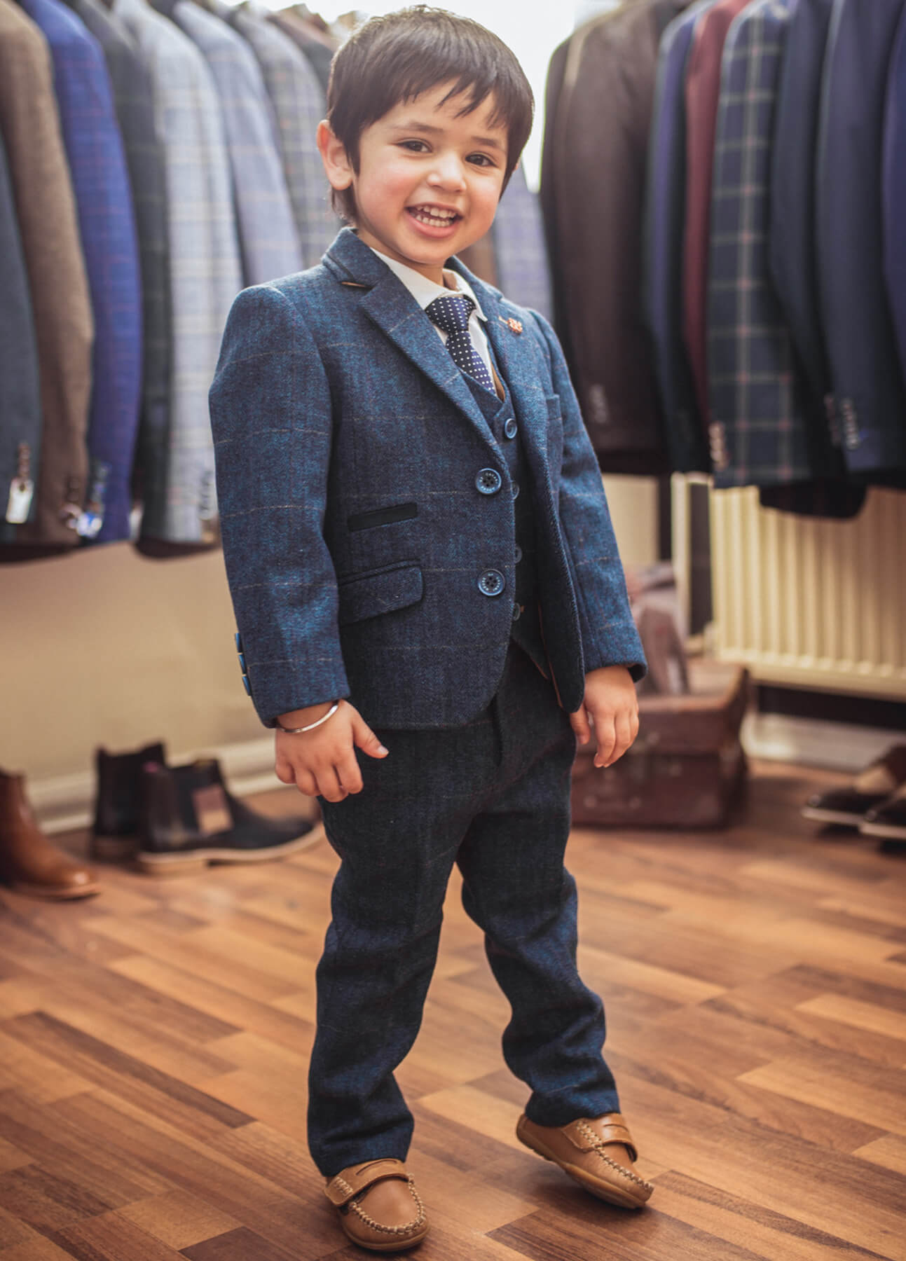 Young boy modelling the Carnegi suit