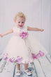 young toddler playing with kenza dress on