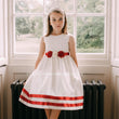 Girl wearing white and red dress