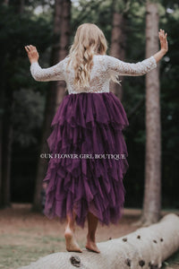 Girl dancing on log in forest