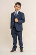 Boy wearing the 3 piece suit 