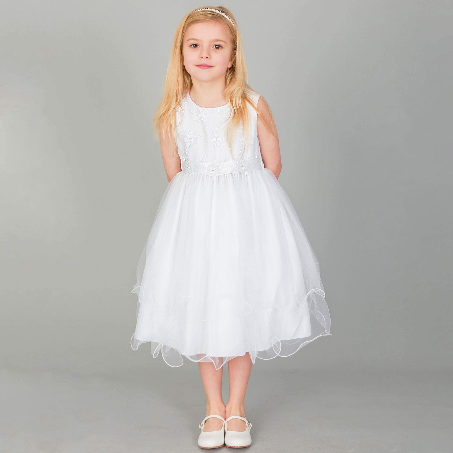 Girl wearing white Tiffany Flower Girl dress