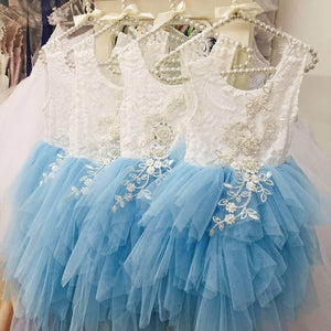 blue and white dresses on hangers