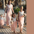 Young girls at a wedding in flower girl dresses